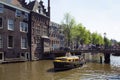 View of canal cruise tour boat passing