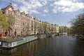 Canal with house boats in Amsterdam Royalty Free Stock Photo