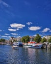 A view of the canal that runs through the center of this tourist town lined with restaurants, stores and parks. WarnemÃÂ¼nde,