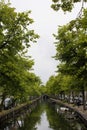 View of canal, trees and bridge in Edam. Royalty Free Stock Photo