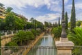 View of a canal of water crossing a park in the Historic Center of Palma de Mallorca, Spain