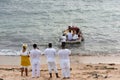 View of Candomble members delivering gifts to Iemanja, the queen of the sea, at Rio Vermelho beach