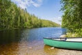 View of the canyon lake Julma-Olkky and canoe on the shore, Hossa National Park