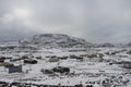 View of Cape Dorset Nunavut with a layer of snow on the ground, a northern Inuit community