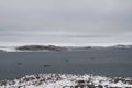 View of Cape Dorset Nunavut with a view of the ocean and boats, a northern Inuit community