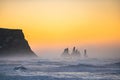 View from cape Dyrholaey on Reynisfjara Beach and Reynisdrangar basalt sea stacks, Iceland. Stormy sunrise Royalty Free Stock Photo