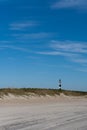 View of the Cape Lookout lighthouse from the beach in the Outer Banks of North Carolina Royalty Free Stock Photo