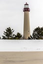 Cape May Lighthouse on a winter day with snow on the beach Royalty Free Stock Photo