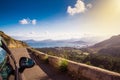 View from car at beautiful summer vacation landscape. Port, sea, mountains. Traveling photo