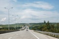 Motorway with a line of big windturbines behind it