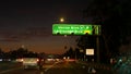 View from the car. Los Angeles busy freeway at night time. Massive Interstate Highway Road in California, USA. Auto driving fast Royalty Free Stock Photo