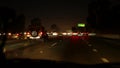 View from the car. Los Angeles busy freeway at night time. Massive Interstate Highway Road in California, USA. Auto driving fast Royalty Free Stock Photo