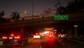 View from the car. Los Angeles busy freeway at night time. Massive Interstate Highway Road in California, USA. Auto driving fast Royalty Free Stock Photo