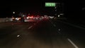 View from the car. Los Angeles busy freeway at night time. Massive Interstate Highway Road in California, USA. Auto driving fast Royalty Free Stock Photo