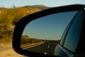 View in the car mirror on fast road in the Spain, beautiful landscape