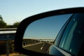 View in the car mirror on fast road in the Spain, beautiful landscape