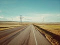 A Canadian prairie landscape with a country road near Pincher Creek, Alberta, Canada Royalty Free Stock Photo