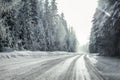 View from a car riding through snow covered winter road Royalty Free Stock Photo