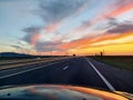 The view from the car`s windshield to the beautiful sunse Royalty Free Stock Photo