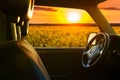View from car window on the field at sunset Royalty Free Stock Photo