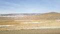 View from the car window at speed blurred view on the landscape of Siberia in the Irkutsk region of Russia. Steppes in winter