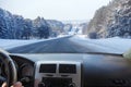 View from the car on a winter snow-covered country road Royalty Free Stock Photo