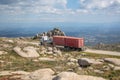 View from Caramulo Mountain, with truck moving along the road, with granite rocks in the surrounding