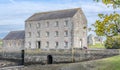 A view of the Carew River, the ruins of the old castle and the Mill house beside the tidal pond in Pembrokeshire, UK Royalty Free Stock Photo