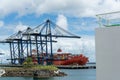 View of a cargo ship unloading a container at the seaport in the city of Salvador, Bahia