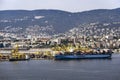 View of cargo ships docked at Pier VII of the Port of Trieste loading:unloading containers Royalty Free Stock Photo