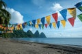 View of Caribbean beach with Prayer Flags and Mountains Scenery Travel Royalty Free Stock Photo