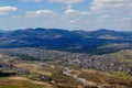 View of the Carpathian Mountains landscape in cloudy summer day. Mountain peaks, forests, fields and meadows, beautiful natural Royalty Free Stock Photo