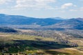 View of the Carpathian Mountains landscape in cloudy summer day. Mountain peaks, forests, fields and meadows, beautiful natural Royalty Free Stock Photo