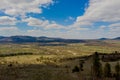 View of the Carpathian Mountains landscape in cloudy summer day. Mountain peaks, forests, fields and meadows, beautiful natural Royalty Free Stock Photo