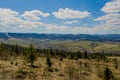 View of the Carpathian Mountains landscape in cloudy summer day. Mountain peaks, forests, fields and meadows, beautiful natural Royalty Free Stock Photo