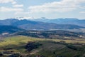 View of the Carpathian Mountains landscape in cloudy summer day. Mountain peaks, forests, fields and meadows, beautiful natural Royalty Free Stock Photo