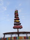 A view of cars stacked one above the other in an amusement park.