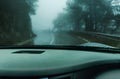 View through the cars windshield in the winter fog on the road Royalty Free Stock Photo