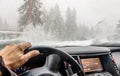 View through the cars windshield in the winter snowy day on the Royalty Free Stock Photo