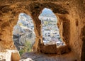 View through carved cave window. Church of St. John the Baptist in Cavusin. Cappadocia. Turkey