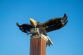 View of Carved wood bald eagle against the blue sky in Port Alberni