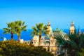 View on the Casino of Monte Carlo, some trees, and the sea