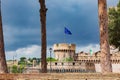 View of Castel Sant` Angelo, Saint Giovanni bastion, EU flag . Cloudy summer day