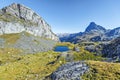 View at Casterau Mountain at left and Casterau lake in French Atlantic Pyrenees, as seen in October. Ossau peak is at background