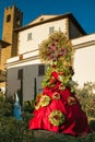 View of Castiglion Fibocchi medieval village with carnival mask