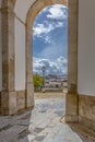 View of the castle and fortress of Obidos, between arches pillars of Lord Jesus of the Stone Sanctuary Royalty Free Stock Photo