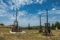 View of catapults under sunny blue sky, in the castle of Baux-de-Provence.