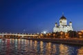 View of the Cathedral of Christ the Savior and the Patriarchal Bridge in the late evening in August from the Moscow River. Royalty Free Stock Photo