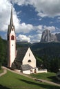 View of the Catholic church Chiesa di San Giacomo and Mount Sassolungo in Ortisei, Italy Royalty Free Stock Photo