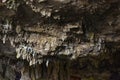 View of a cave ceiling with close-up view of stalagtites Royalty Free Stock Photo